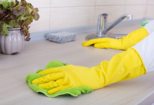 Cleaner handling waste safely with protective equipment